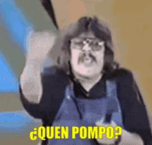 a man with glasses and a mustache is holding a knife and asking " quen pompo "