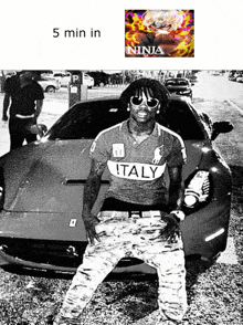 a black and white photo of a man in front of a car with the caption 5 min in ninja