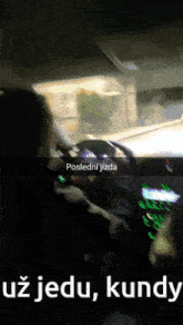 a man driving a car with a caption that says posledni jezda