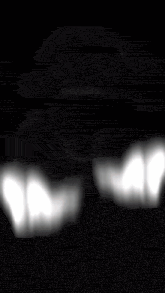 a black and white photo of a person screaming with their mouth wide open