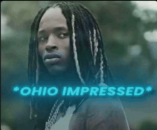 a man with dreadlocks and the words ohio impressed behind him
