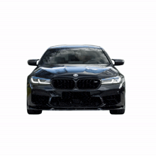 the front of a black bmw with the letters m on the grille