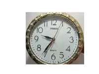 a standard quartz clock shows that it is almost 5:00