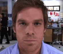 a close up of a man 's face with a beard in a lab .