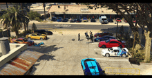 a group of cars are parked in a parking lot in front of a store called fleeca