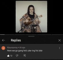 a video of a man playing an ukulele has a reply from jaysaysnay below it