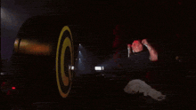 a man is doing a handstand in front of a circle that says ' g ' on it