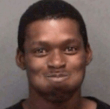 a close up of a man 's face with a funny face .