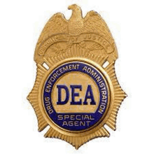 a badge for a drug enforcement administration special agent with an eagle on it .