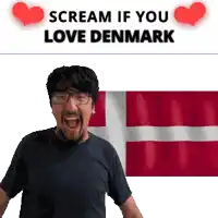 a man is screaming in front of a denmark flag