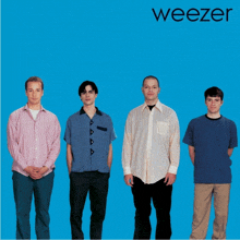 a group of men standing in front of a blue background that says weezer on it