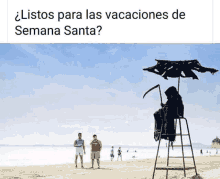 a grim reaper is sitting on a lifeguard stand on a beach