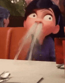 a cartoon character is drinking from a glass with a straw .