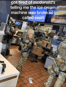 a man in a military uniform is standing in a mcdonald 's restaurant