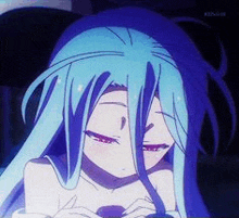 a girl with long blue hair is sitting down with her eyes closed and a straw in her mouth .