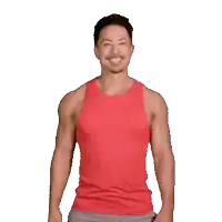 a man in a red tank top makes a heart with his hands