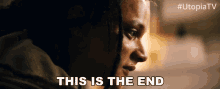 a close up of a woman 's face with the words " this is the end " above her