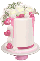 a white cake with pink and white hearts and flowers on top