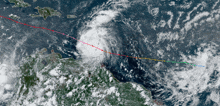 an aerial view of a hurricane with a red line showing the path