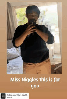 a man taking a picture of himself in a mirror with the words miss niggles this is for you