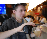 a man is pouring a drink from a bottle with a label that says ' amber ale '