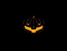 a halloween pumpkin with a smile on it 's face on a black background