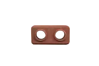 a brick with two holes in the middle on a white background