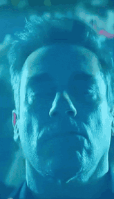 a man with his eyes closed in a blurry photo