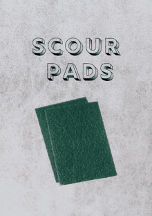 a pair of green scouring pads on a gray surface