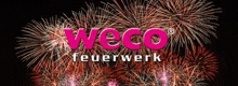 there is a fireworks display in the background and the logo for weco feuerwerk