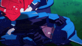 a blue robot with a red head is standing in a grassy field