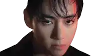 a close up of a young man 's face with wet hair