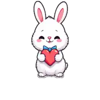 a white bunny rabbit is holding a red heart in its hands