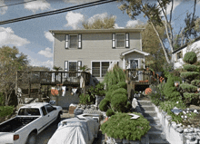 a white truck is parked in front of a house with an arrow pointing to the right