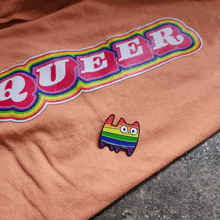 a t-shirt that says queer on it