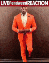 a man in an orange suit is walking with the words live pondweed reaction behind him