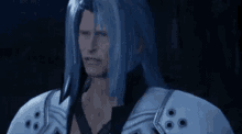 a man with blue hair and a white armor is standing in the dark .