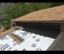 a roof is being installed with a roofing material called gar