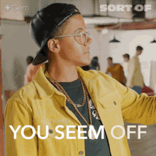 a man wearing glasses and a yellow jacket has the words you seem off on the bottom