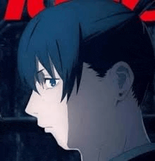 a close up of a person 's face with a blue haircut .
