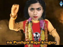 a woman in a red shirt with a skull on it and the words na pushpa raje kinguu