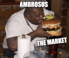 a man is eating a large hamburger with the words ambrosus the market written on it