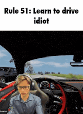 a man is sitting in a car with the words rule 51 learn to drive idiot