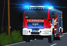 a red and white man fire truck with feuerwehr written on the front