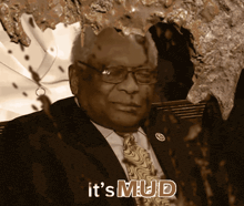 a man in a suit and tie with the words it 's mud on the bottom