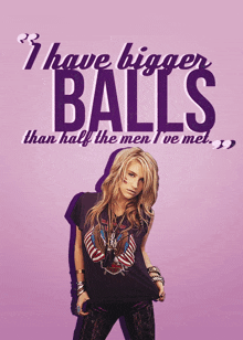 a woman stands in front of a poster that says i have bigger balls