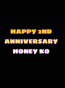 a black background with yellow and purple text that says " happy 2nd anniversary honey ko "