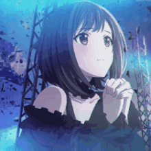 a girl with short hair and a black dress is praying