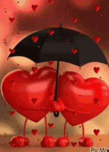 a couple of hearts holding an umbrella in the rain