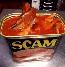 a can of scam meat is sitting on a metal table .